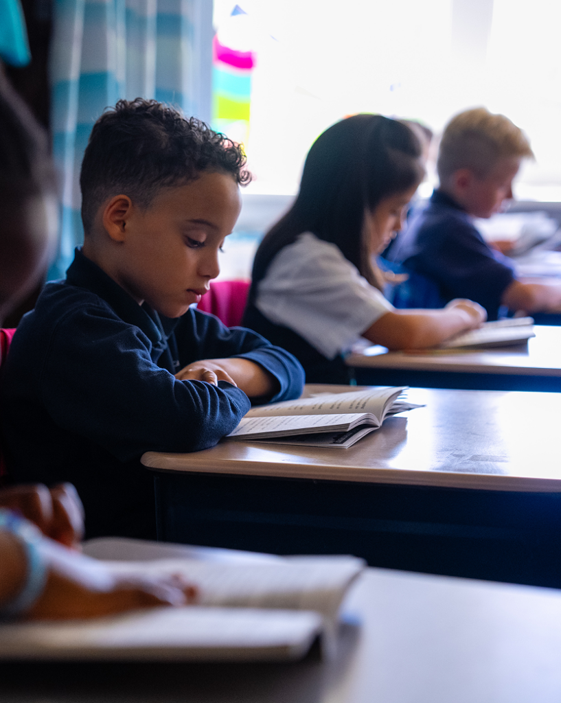 Students at St. Monica School doing schoolwork