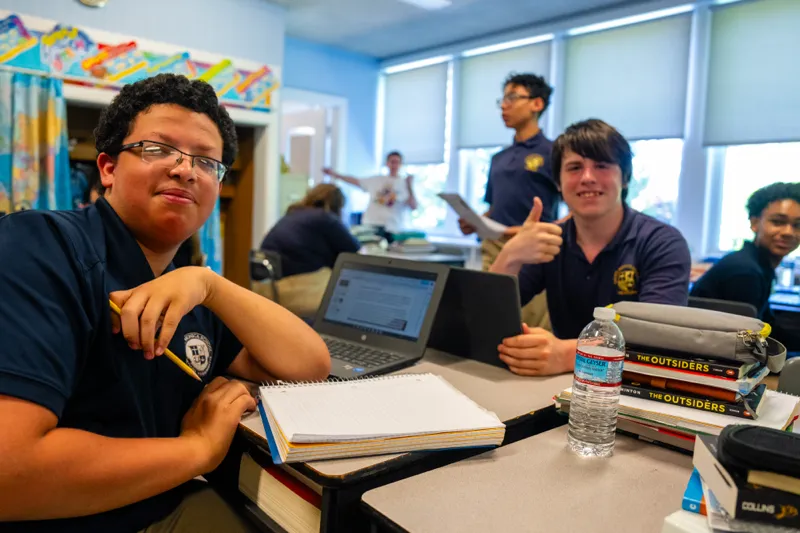 Students at St. Monica School doing schoolwork